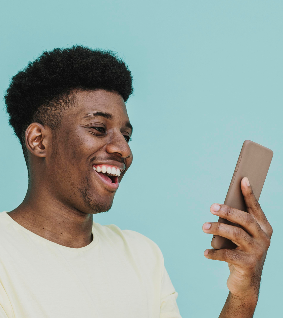 Smiling man using gidipay app on his mobile phone